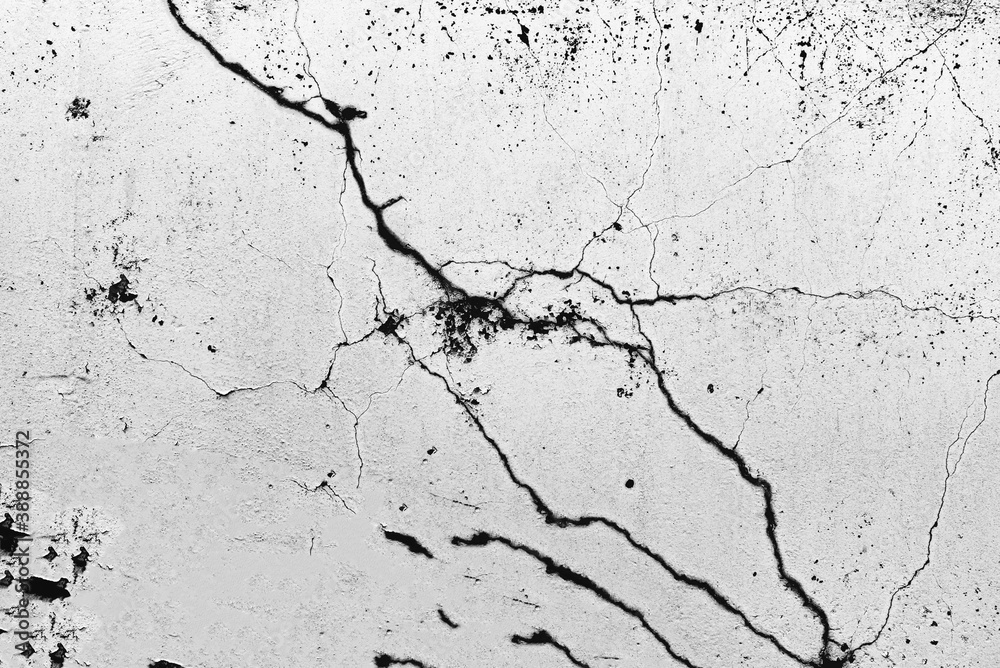 Texture of a concrete wall with cracks and scratches which can be used as a background