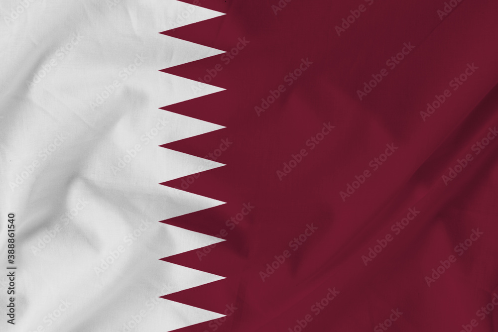 Obraz premium Flag of Qatar on Fabric texture