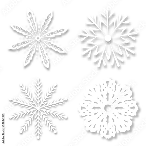 Paper snowflakes with soft shadows on a white background. realistic vector illustration.