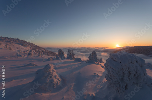 sunset over frozen landscape