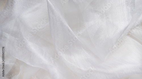 Photo of white silk draped. View from above. Abstract background. 