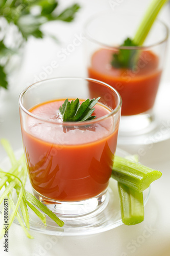 Wallpaper Mural delicious tomato juice poured into a glass, with parsley and celery Torontodigital.ca