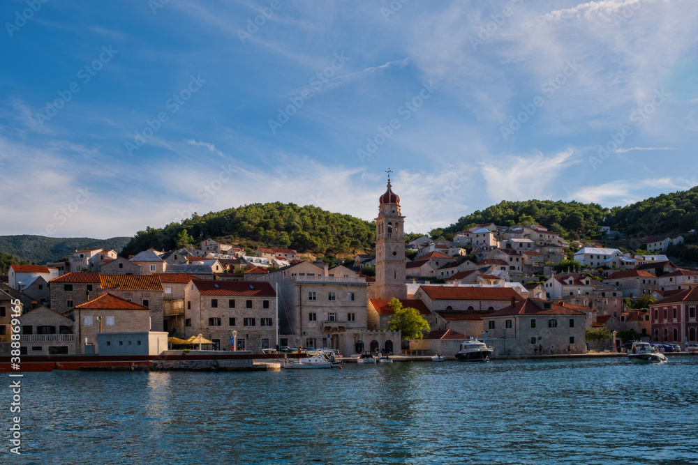 Naklejka premium Pucisca is small town on Island of Brac, popular touristic destination on Adriatic sea, Croatia. August 2020.