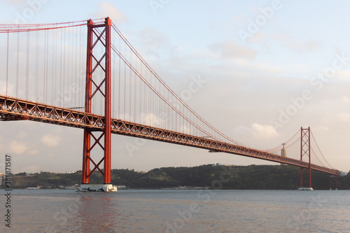 Tagus river with 25th of April Bridge on background in Lisbon, Portugal. Tourist attraction, vacation destination concepts