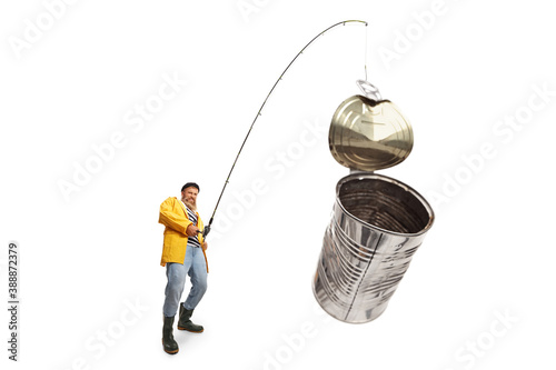 Canvas-taulu Fisherman catching tin can on a fishing rod