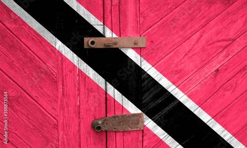 Trinidad and Tobago flag is on texture. Template. Coronavirus pandemic. Countries may be closed. Locks. photo