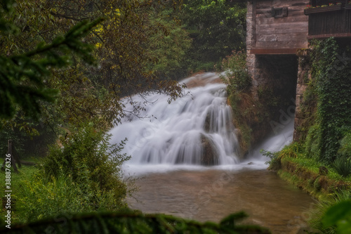 Waterfall on Korana river canyon in village of Rastoke. Slunj in Croatia. Near Plitvice Lakes National Park. August 2020  long exposure picture.