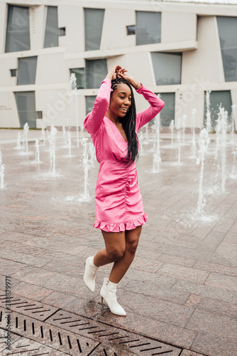 Woman in Pink dress walking outdoors photo