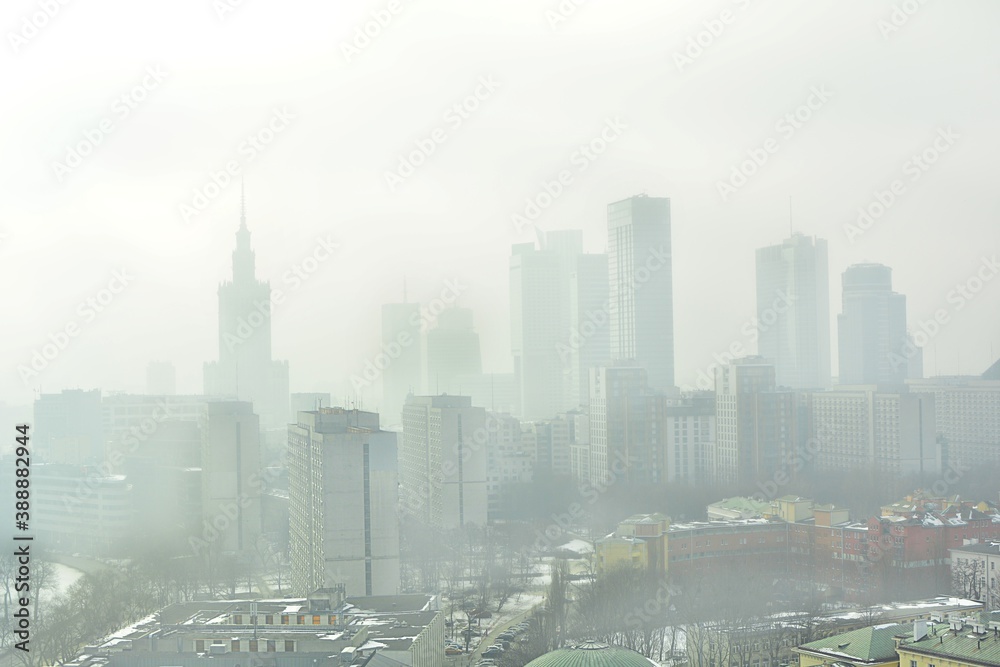 Characteristic view of a modern city skyline covered in a dense smog and pollution - obrazy, fototapety, plakaty 