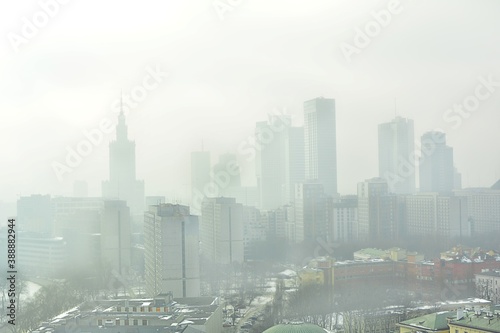 Characteristic view of a modern city skyline covered in a dense smog and pollution photo