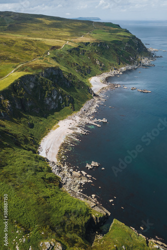 Aerial view of green cliffs by the sea photo