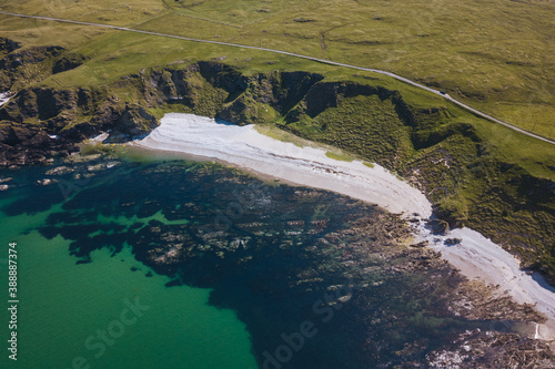 Aerial view of a beach with rocks and sea photo