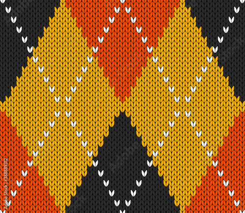 Knitted argyle Halloween pattern. Wool knitinng. Scottish plaid in orange, black and yellow rhombuses. Traditional  Scottish background of diamonds . Seamless fabric texture. Vector illustration