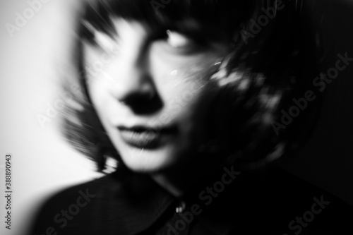 envy, black and white portrait of envious woman with motion blur