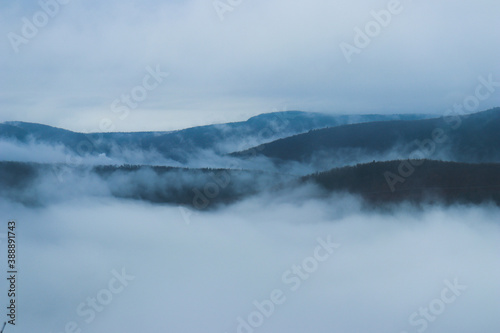 Mountains hide by cold fog