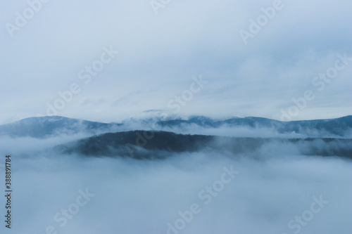 Mountains hide by cold fog