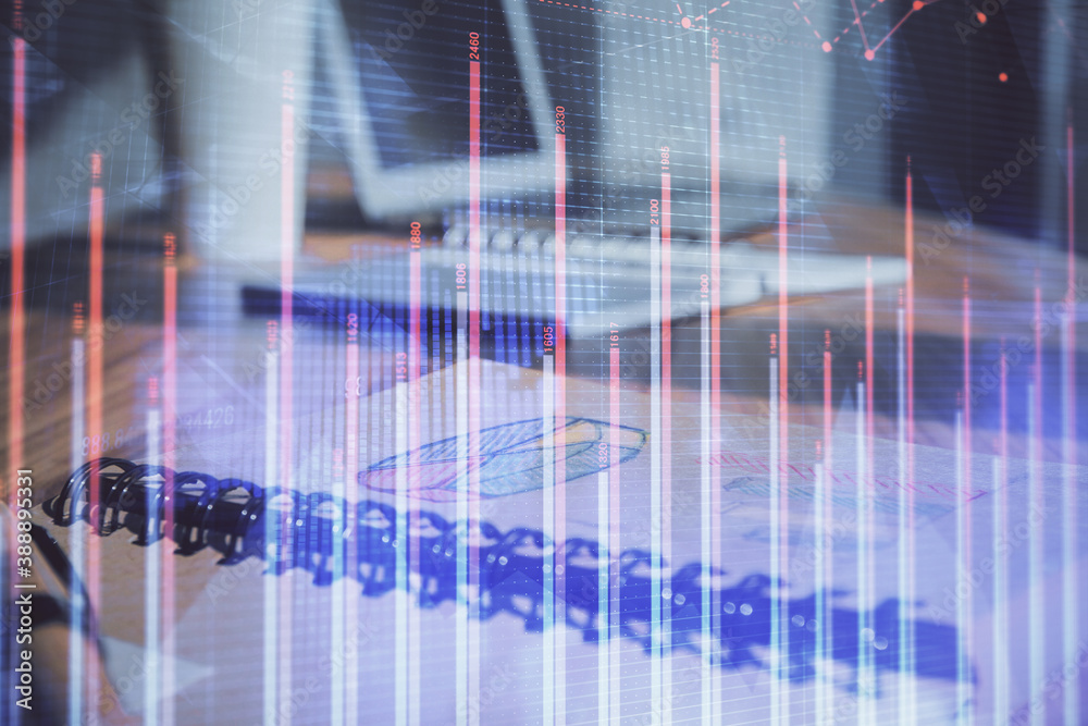 Double exposure of financial graph drawings and desk with open notebook background. Concept of forex market Double exposure of financial graph drawings and desk with open notebook background. Concept of forex market