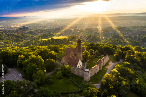 Germany, Bavaria, Bamberg, Helicopter view of Altenburg castle at summer sunset photo