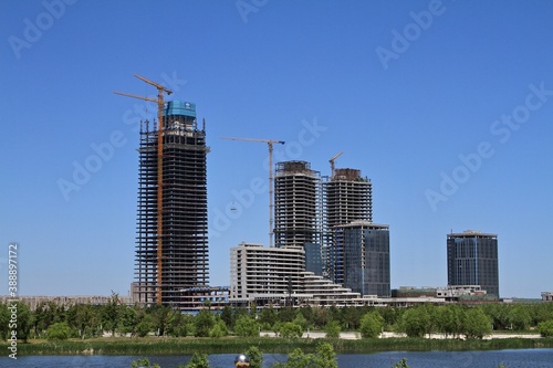 Skyscraper buildings under construction on the lake shore in China