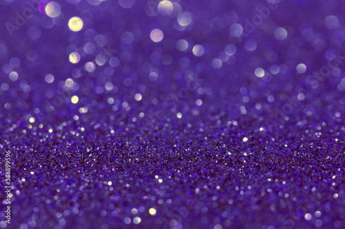 Abstract purple blue background with bokeh effect. Blurred glitter.