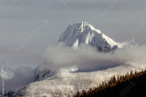 majestic snow covered mountain peak, Glacier National Park, Montana