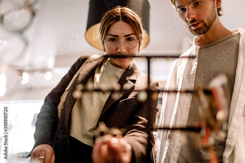 Man and woman looking at eyewear in retail store photo