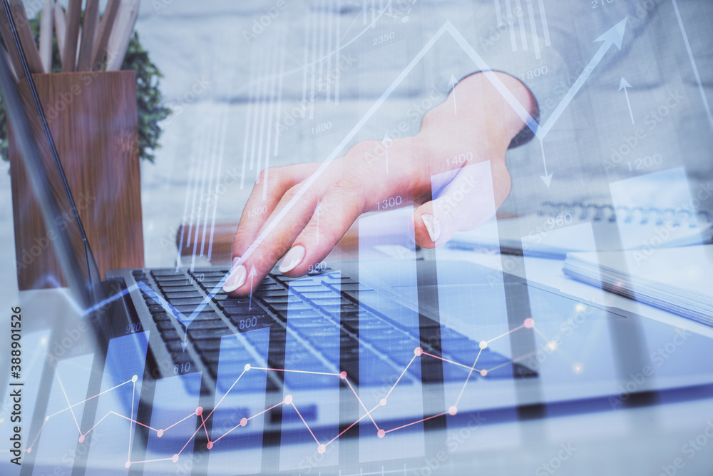 Multi exposure of woman hands typing on computer and forex chart hologram drawing. Stock market analysis concept. Multi exposure of woman hands typing on computer and forex chart hologram drawing. Stock market analysis concept.