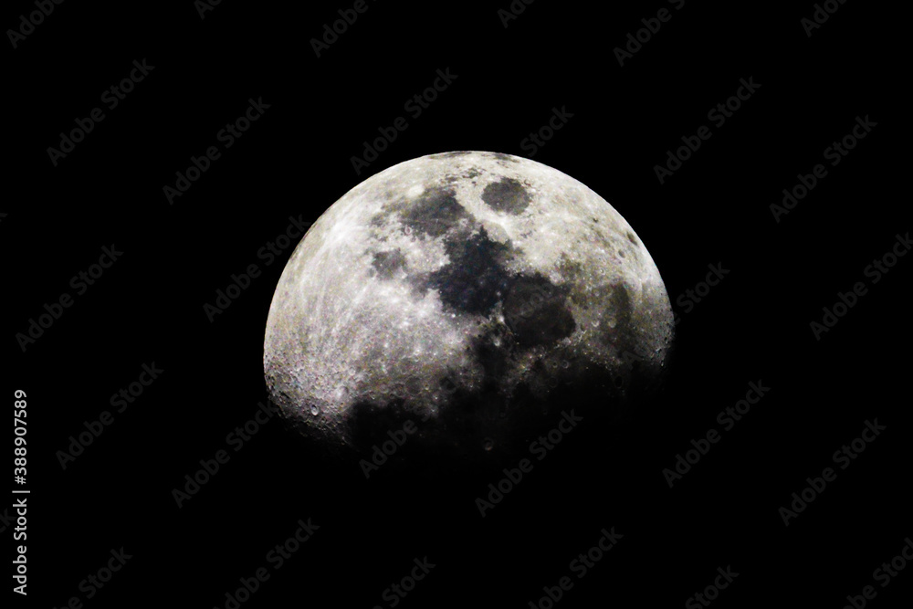 Obraz premium Moon is a gravity rounded astronomical body orbiting Earth and is the planet's only natural satellite. It is the fifth largest satellite in the Solar System