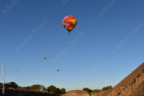 Flying air balloons in the air at the pyramids of Teotihuacan, Mexico. 
