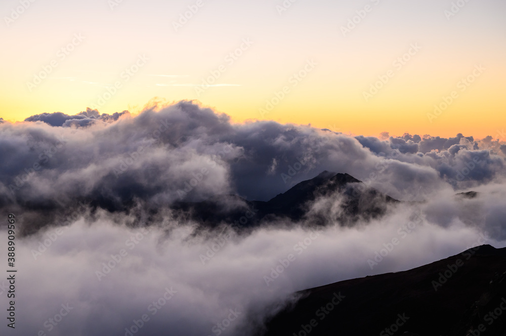 Clouds over mountains seen from the Haleakala volcano. Maui, Hawaii.
