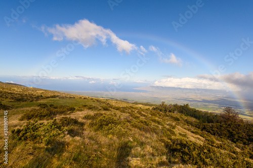 Full rainbow seen from the road to Haleakala National Park. Maui  Hawaii.