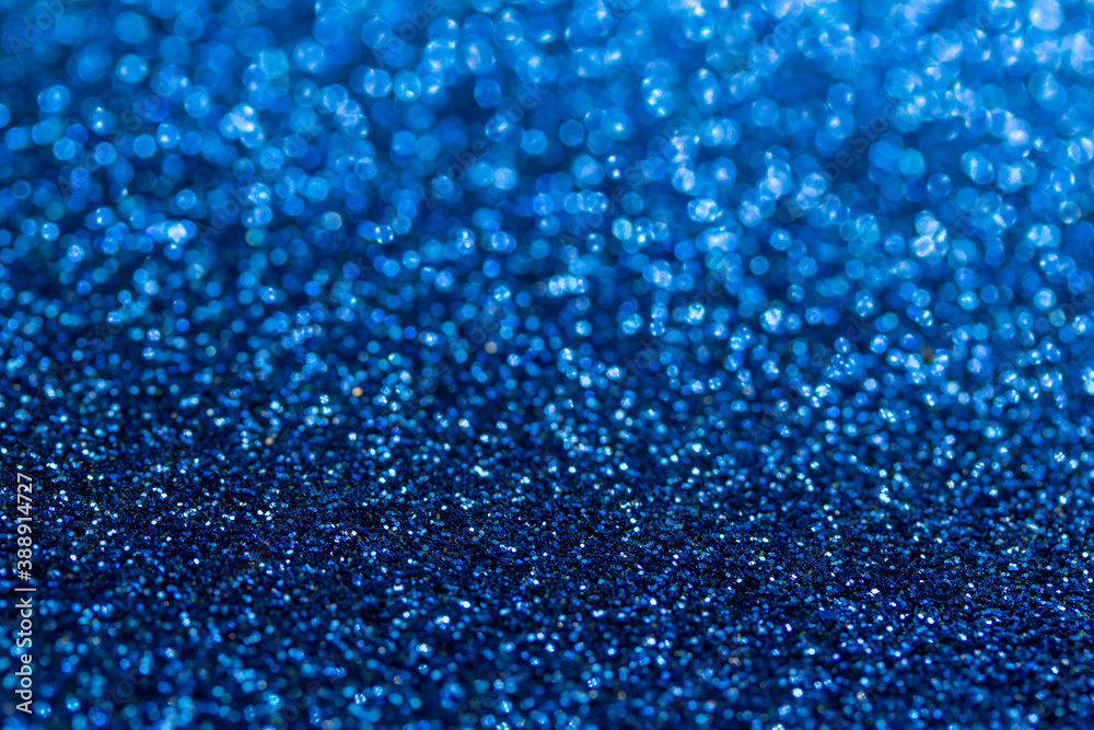 Full frame macro abstract background of sparkling blue color glitter texture, with bokeh and copy space Full frame macro abstract background of sparkling blue color glitter texture, with bokeh and copy space