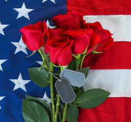 American flag with roses and blank military dog tags