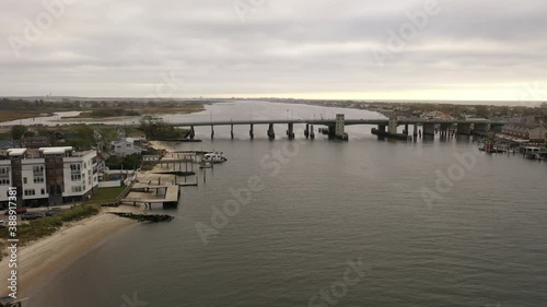 Wallpaper Mural An aerial shot over the East Rockaway Inlet in NY. The drone dolly in to the Nassau Expressway drawbridge on a cloudy morning with no people in view, only two cars driving over the bridge. It is calm. Torontodigital.ca