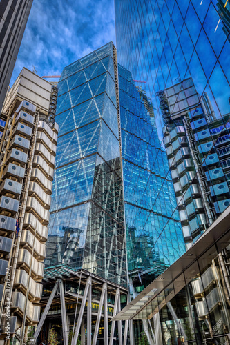 Modern skyscrapers in concrete  steel and glass  reflect off each other creating a dynamic city scene in a financial business district