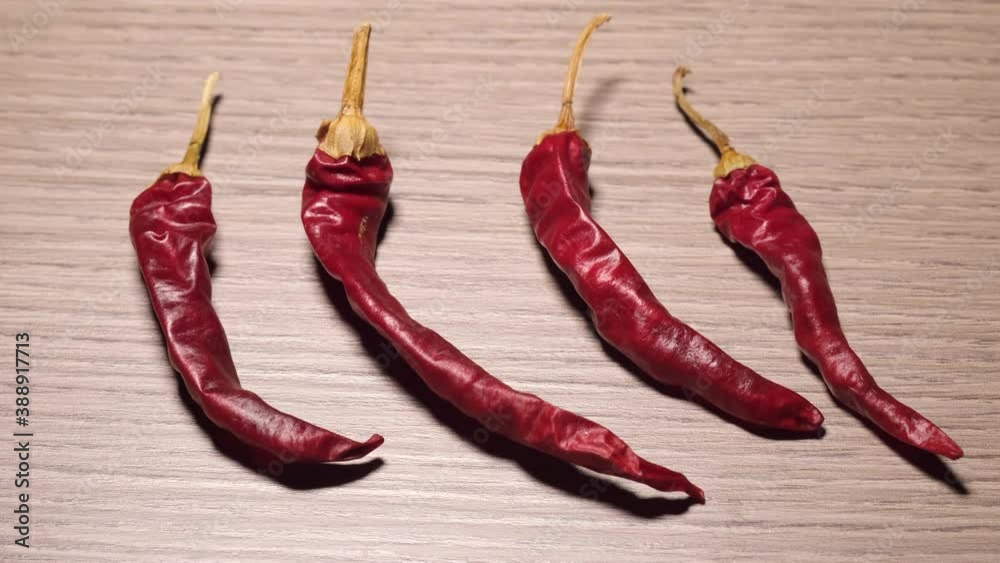 Chili peppers illuminated on wooden background. Chili peppers illuminated on wooden background.