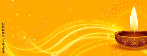 happy diwali yellow banner with diya and light effect