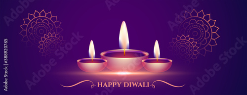 decorative happy diwali purple banner with diya design