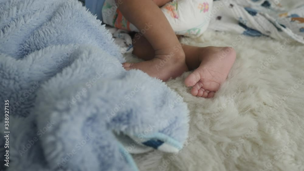 sleepy baby sleeping on the soft bed at home, newborn infant concept sleepy baby sleeping on the soft bed at home, newborn infant concept