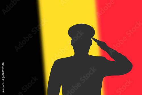 Solder silhouette on blur background with Belgium flag.