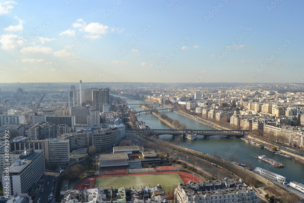 View of City Paris from Eiffel Tower. Panoramic Paris city view and Seine River from the most well know building of France: Top of Eiffel Tower.