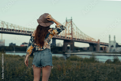 Woman hat city bridge shorts photo