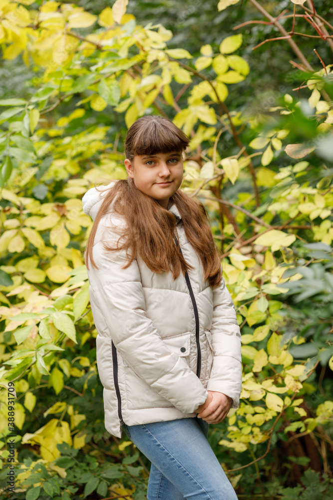Close up portrait of caucasian smiling girl outside in park, autumn time Close up portrait of caucasian smiling girl outside in park, autumn time