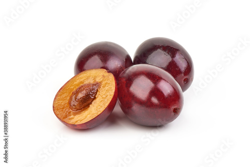 Fresh juicy plums, isolated on white background
