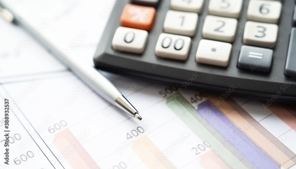 Analysis of reports, pen and calculator on the table .Finacial and business concept. Analysis of reports, pen and calculator on the table .Finacial and business concept.