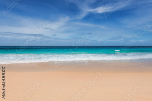 Tropical paradise beach background with warm sand and turquoise sea in paradise island. Tropical beach background.