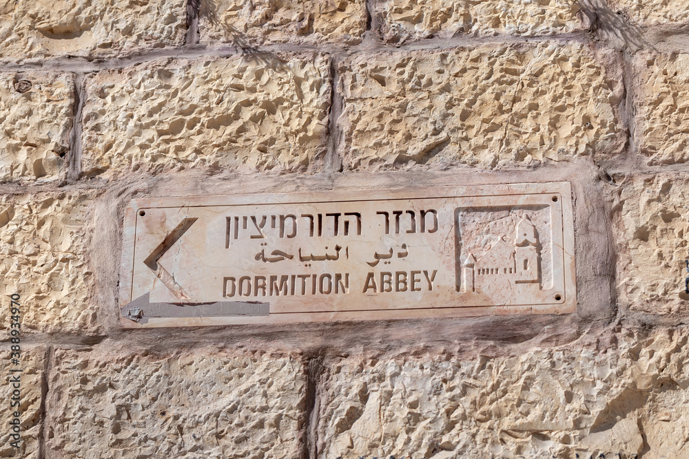 The signpost  to Dormition Abbey on the city wall near the Zion Gate in the old city of Jerusalem, Israel