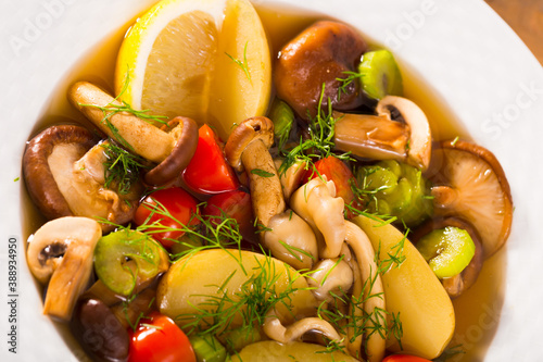 Mushroom hoosh boiled with honey fungus, lemon and vegetables photo