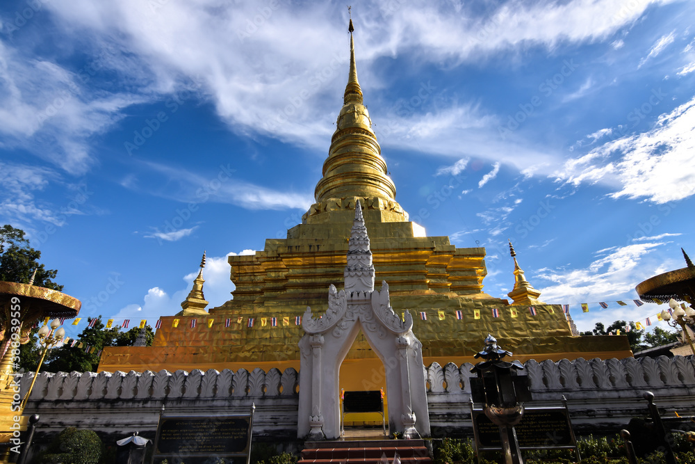 Naklejka premium The Golden Stupa in Lanna architecture style of Wat Phra That Chae Haeng Temple, The iconic destination in Nan Province, Thailand