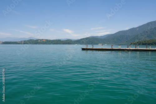 The pier at Sun moon lake, Nantou, Taiwan. Against mountains and blue sky.